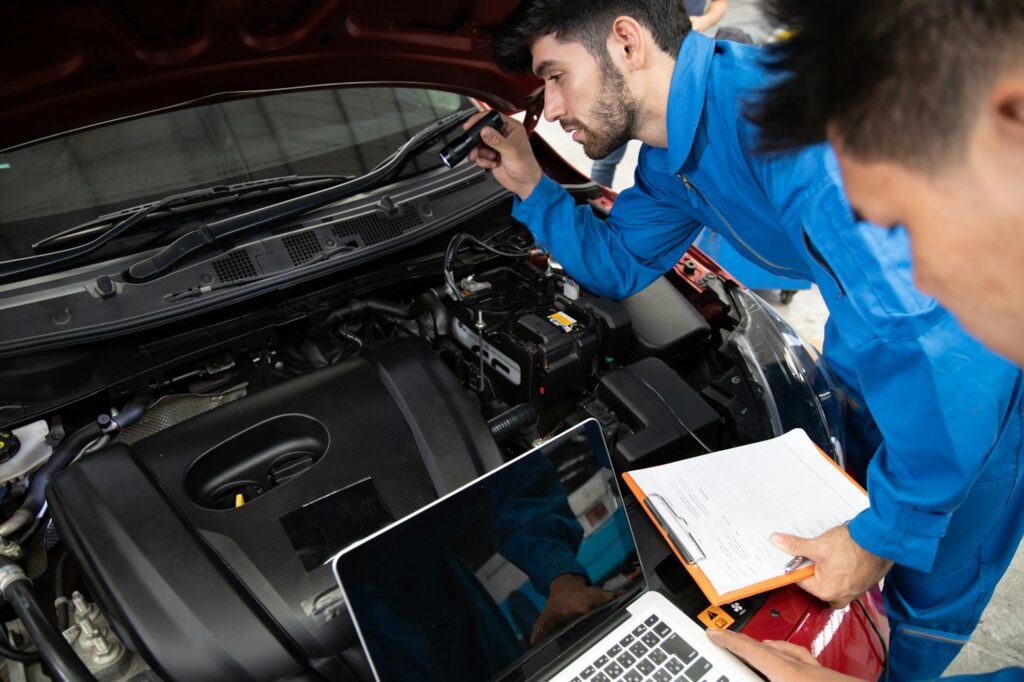 Mechanics are checking the availability of the car.